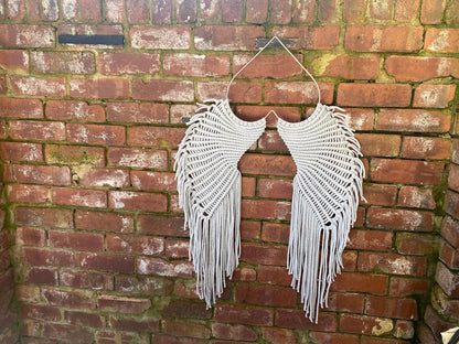 Macrame angel wings representing protection and love