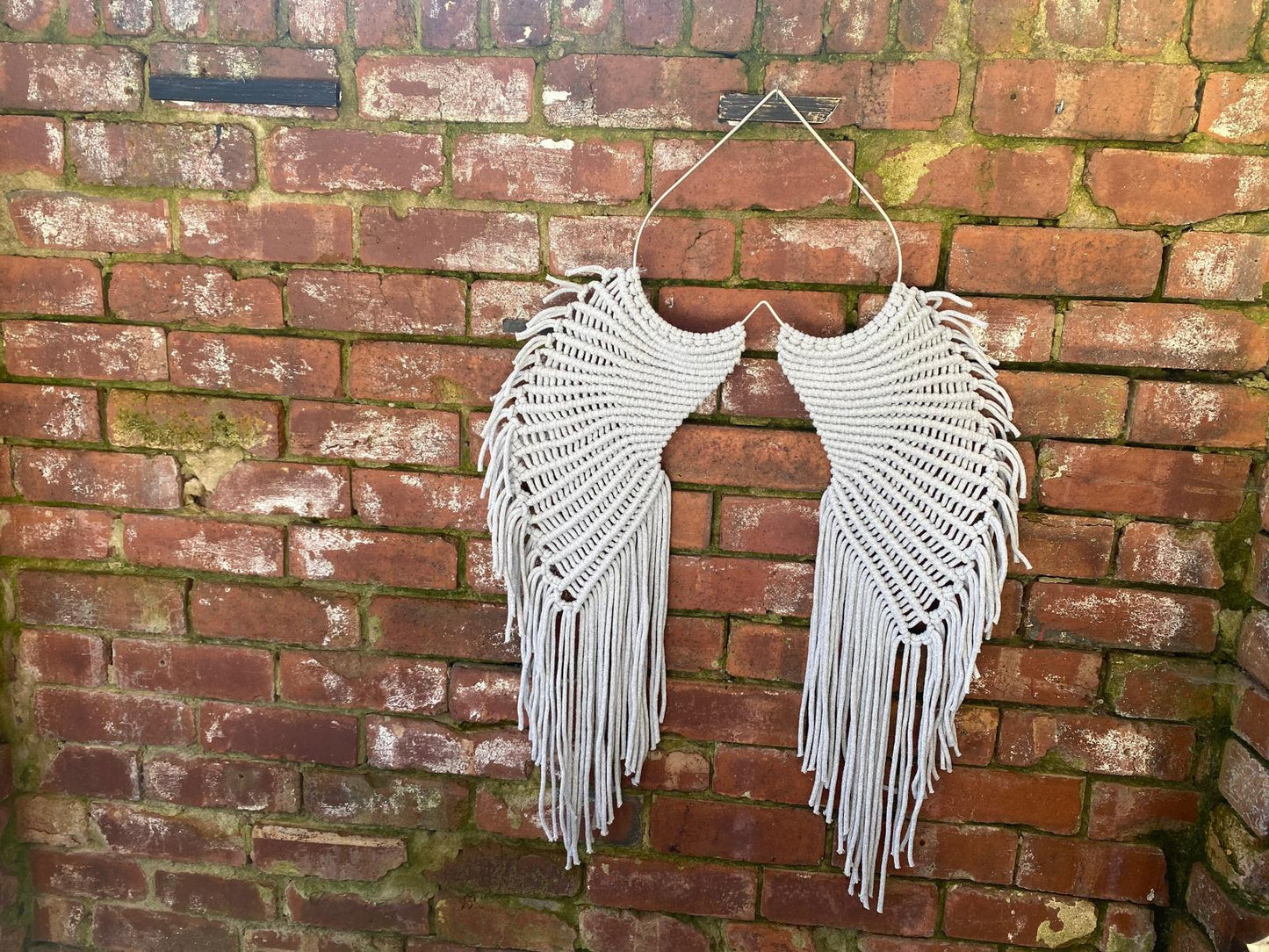 Macrame angel wings representing protection and love