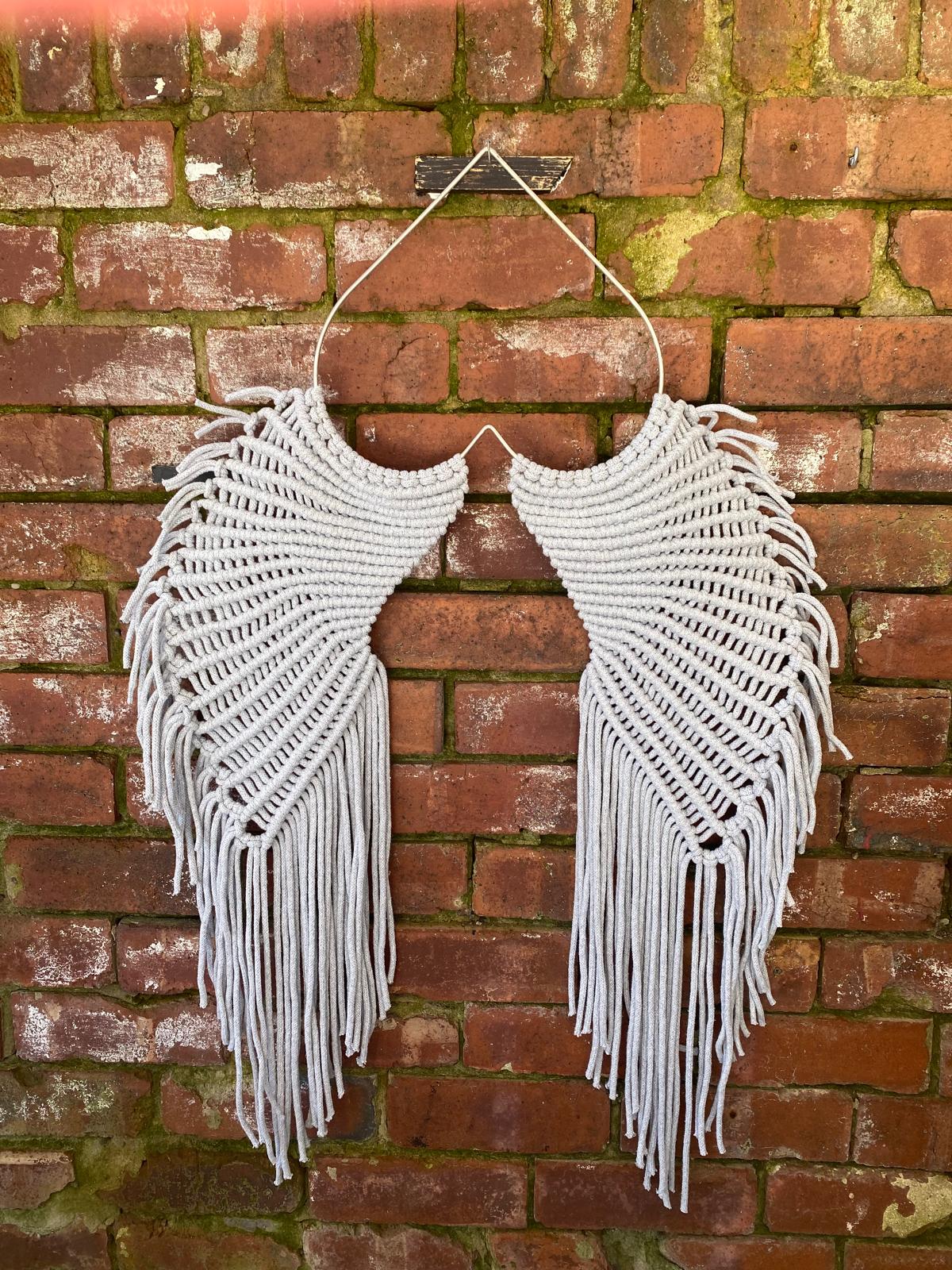 Macrame angel wings representing protection and love