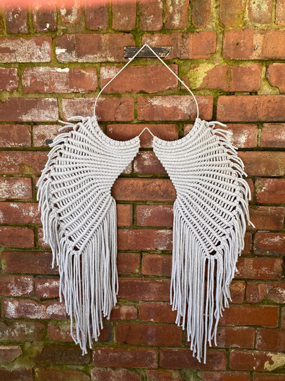 Macrame angel wings representing protection and love