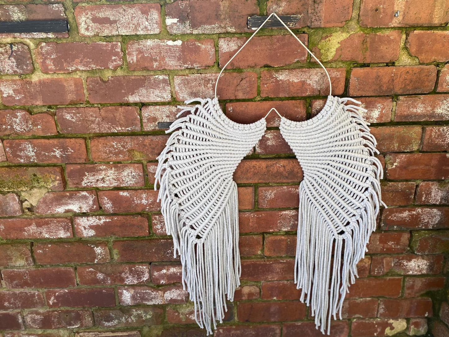 Macrame angel wings representing protection and love