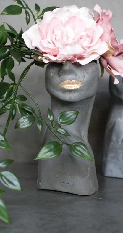 Woman half face stone vase