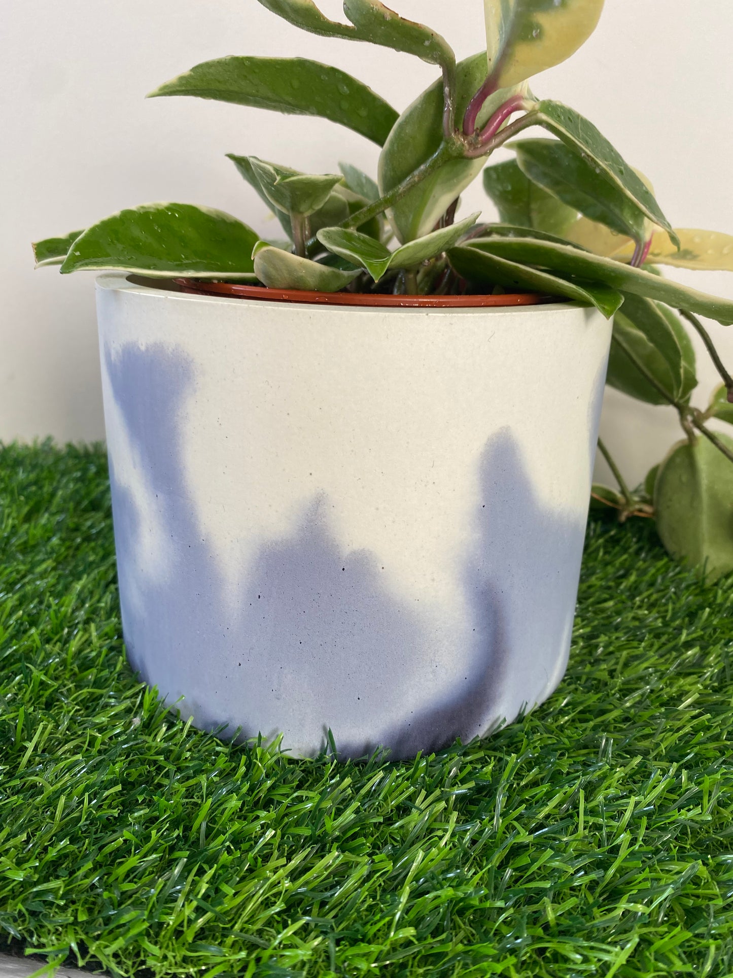 Marble effect round large concrete plant pot