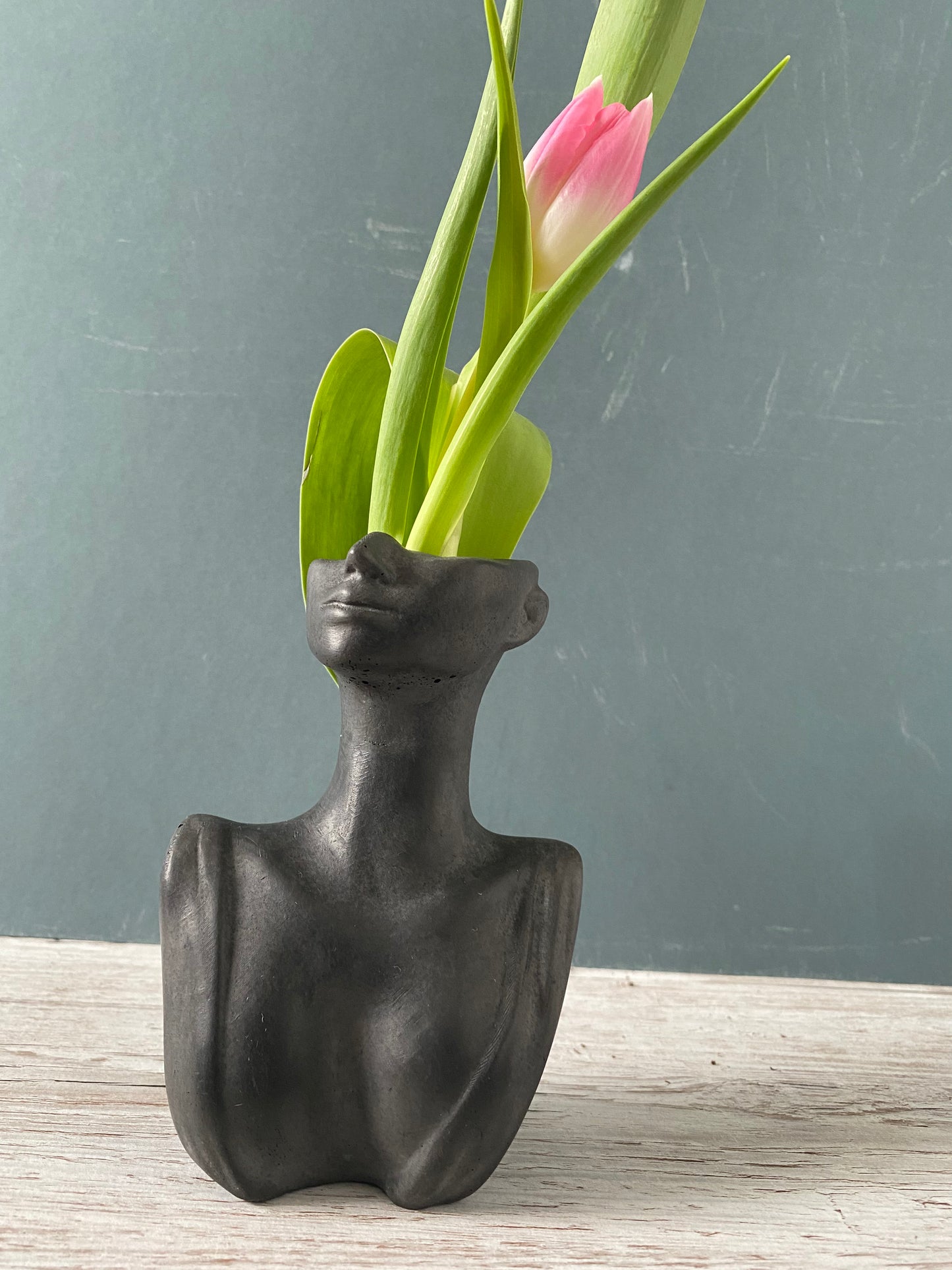 Woman half face bust vase