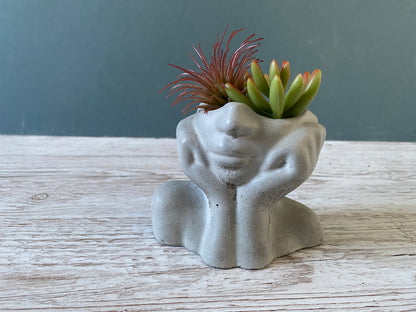 Woman half face succulent air plant vase