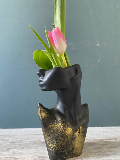 Woman half face stone vase