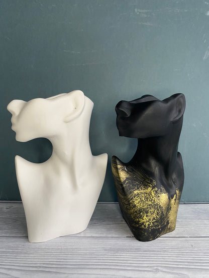 Woman half face stone vase