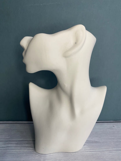 Woman half face stone vase