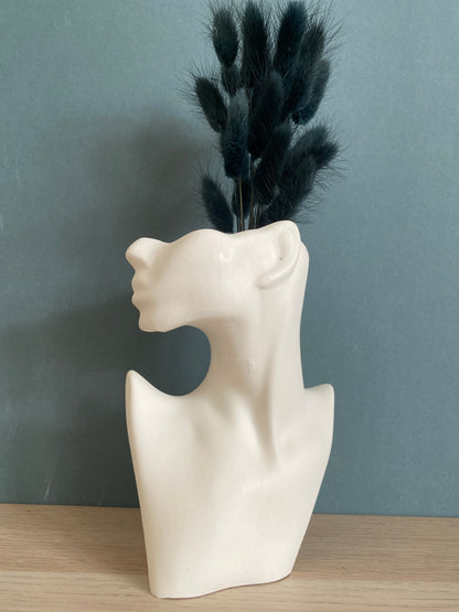 Woman half face stone vase