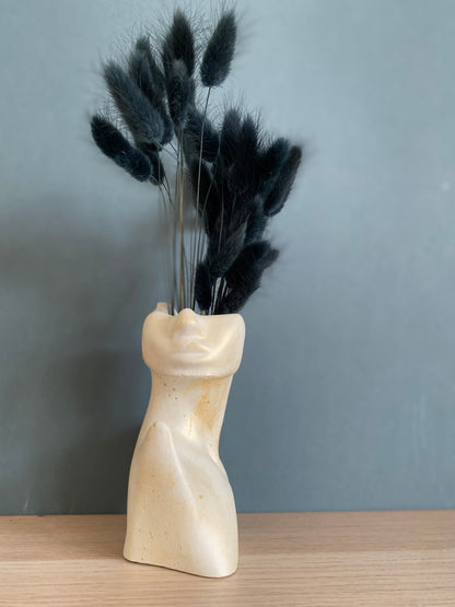 Woman half face stone vase